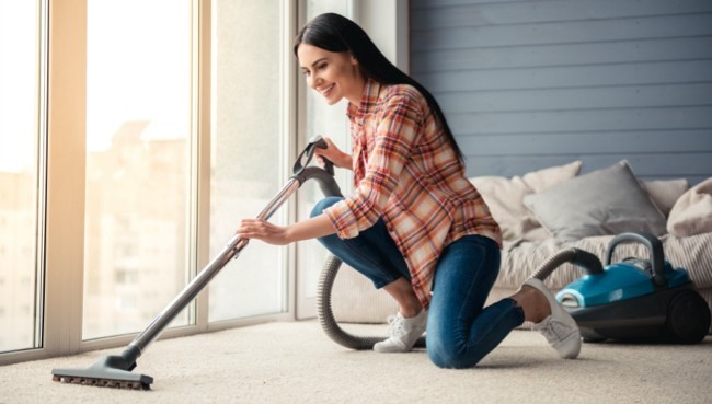 Lady cleaning carpet floor | CarpetsPlus COLORTILE of Hutchinson