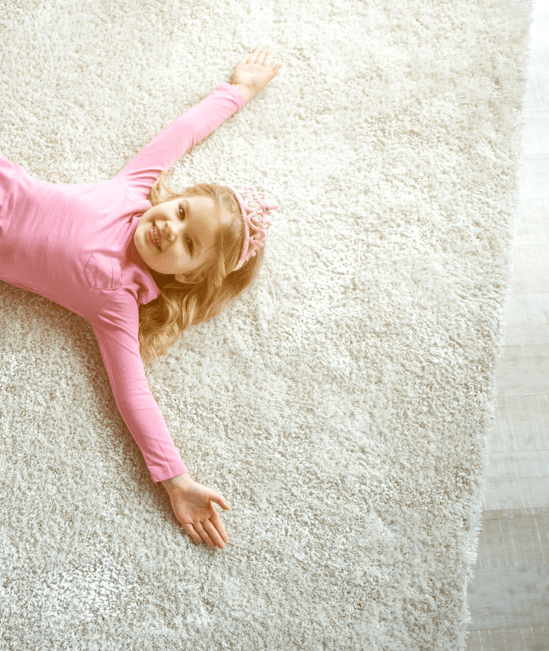 Cute girl laying on rug | CarpetsPlus COLORTILE of Hutchinson
